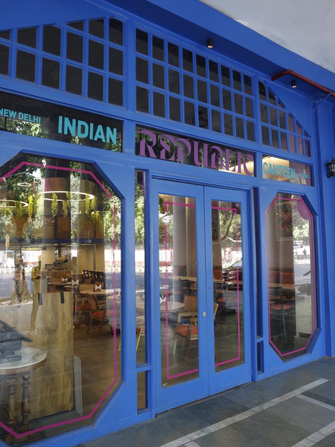 The blue shopfront at H-26 with the Indian Republic Canteen sign above glass doors