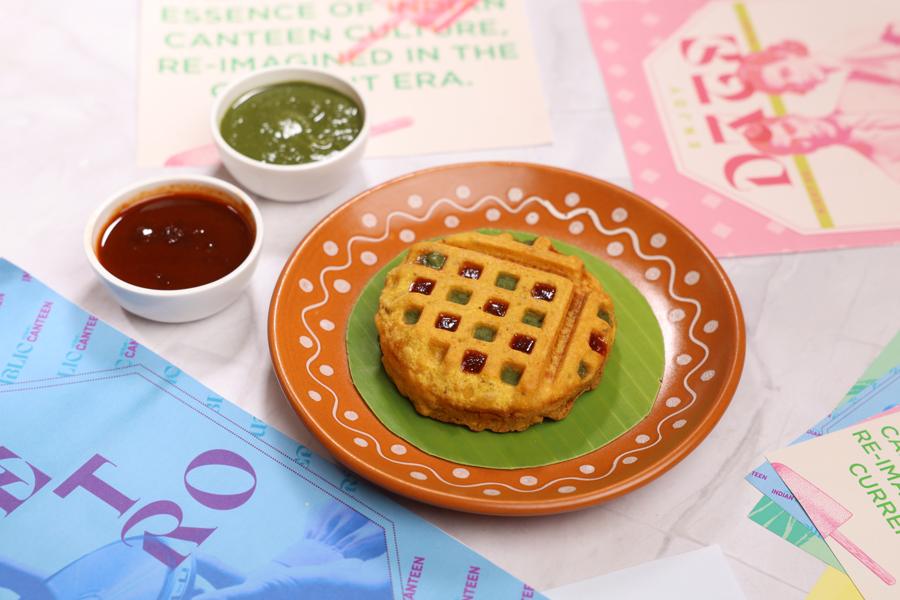 Waffle bread pakora on a banana leaf with green and tamarind chutneys